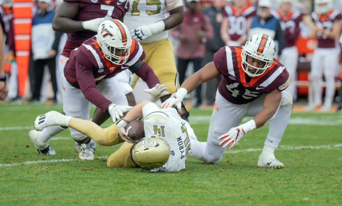 Nov 5, 2022; Blacksburg, Virginia, USA; Virginia Tech Hokies defensive lineman Jaylen Griffin (41) and Virginia Tech Hokies defensive lineman sack Virginia Tech Hokies defensive lineman TyJuan Garbutt (45) sack Georgia Tech Yellow Jackets quarterback Zach Pyron (14) in the firsbhalf at Lane Stadium. Mandatory Credit: Lee Luther Jr.-USA TODAY Sports